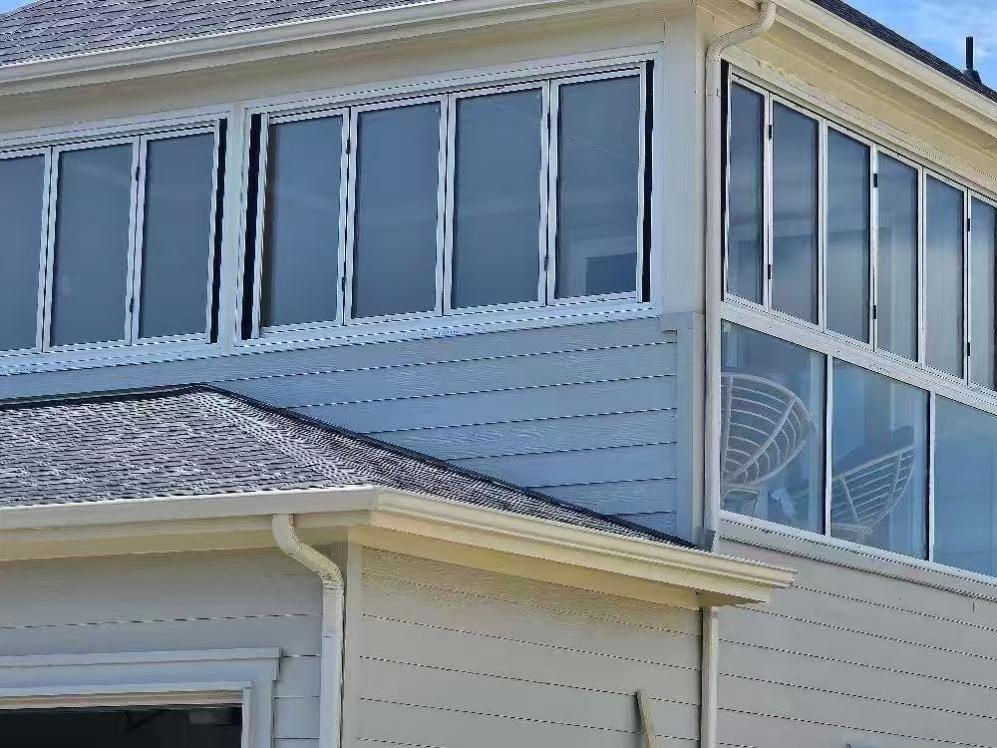 Innovative Patio Enclosure with Bi-fold Windows in an American House Project